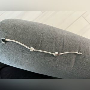 Pandora bracelet with two sunburst clips